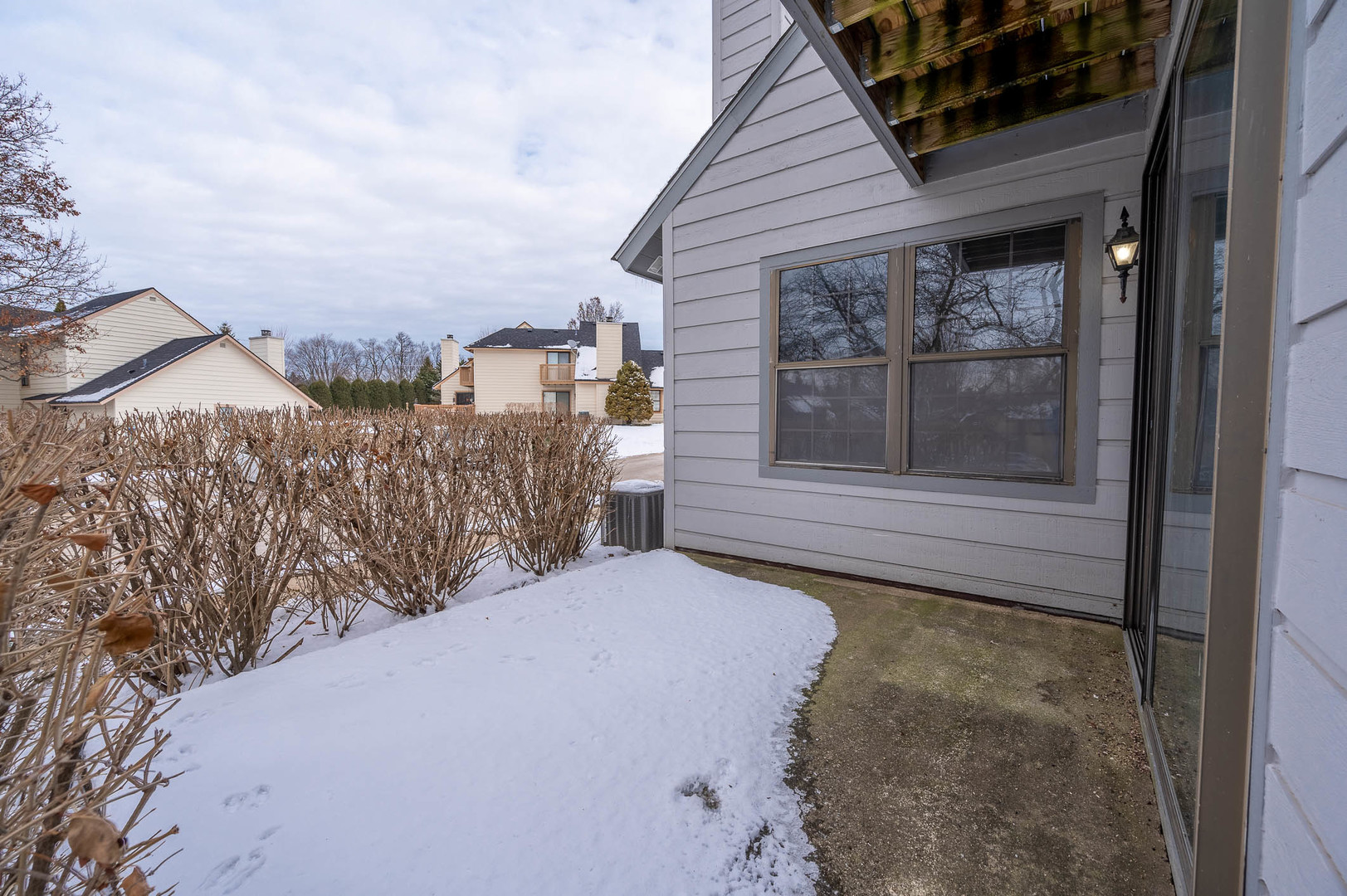 586 Dunham Road Gurnee, IL 60031 - Photo 13 of 13 a view of a house with a snow in the yard