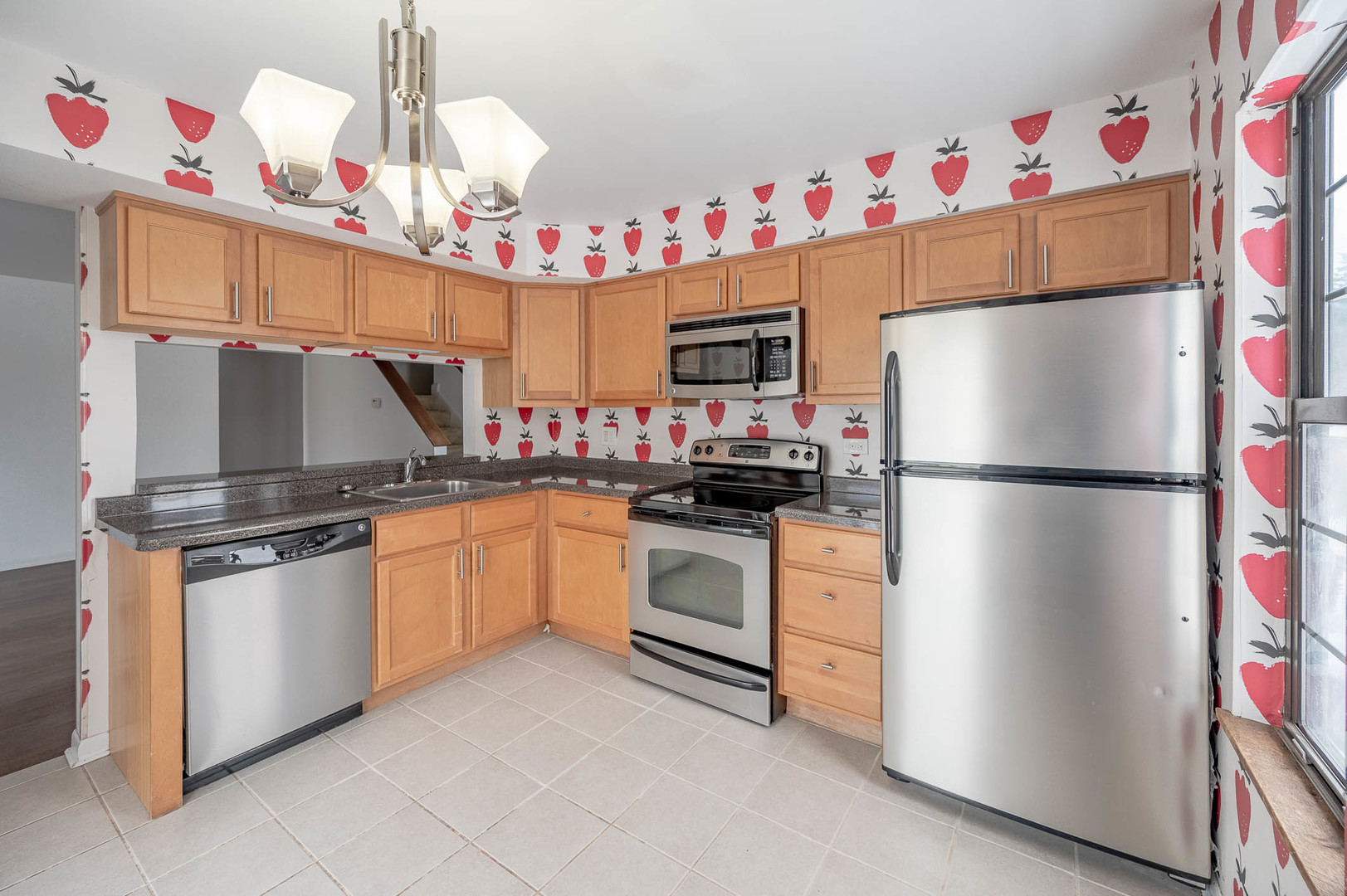 586 Dunham Road Gurnee, IL 60031 - Photo 5 of 13 a kitchen with granite countertop a sink stainless steel appliances and cabinets