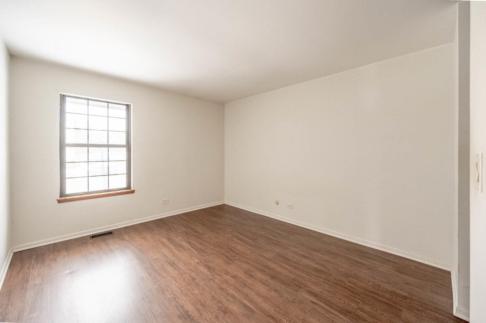 586 Dunham Road Gurnee, IL 60031 - Photo 6 of 13 an empty room with wooden floor and windows