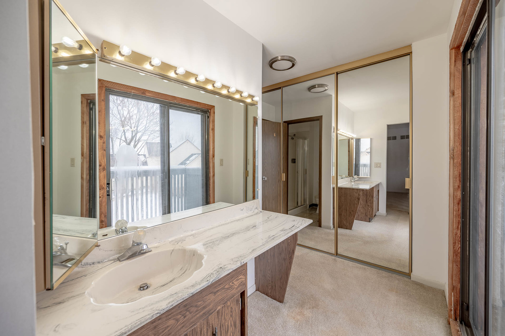 586 Dunham Road Gurnee, IL 60031 - Photo 10 of 13 a bathroom with a granite countertop sink and a large mirror