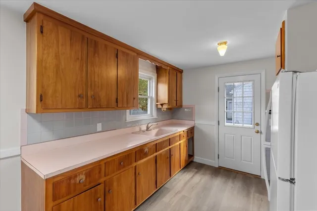 a kitchen with a sink and cabinets