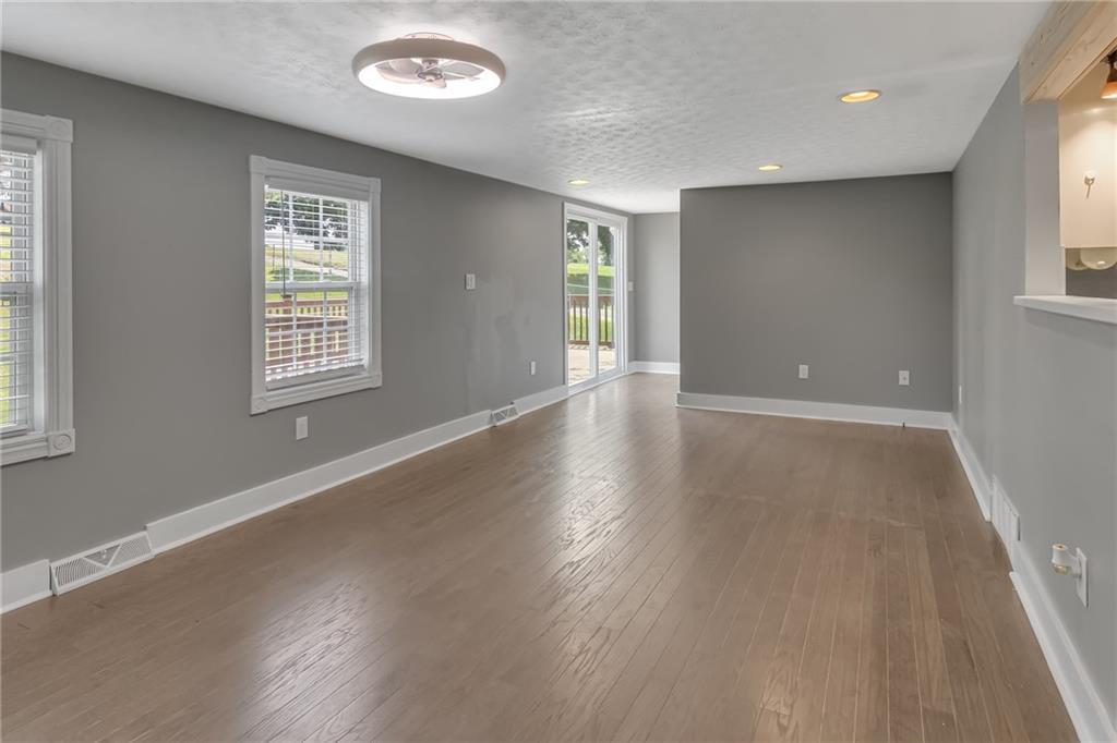 143 Inman Drive New Brighton, PA 15066 - Photo 12 of 29 a view of an empty room with wooden floor and a window