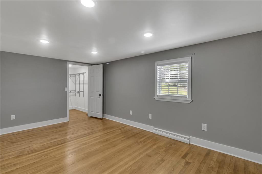 143 Inman Drive New Brighton, PA 15066 - Photo 14 of 29 an empty room with wooden floor and windows