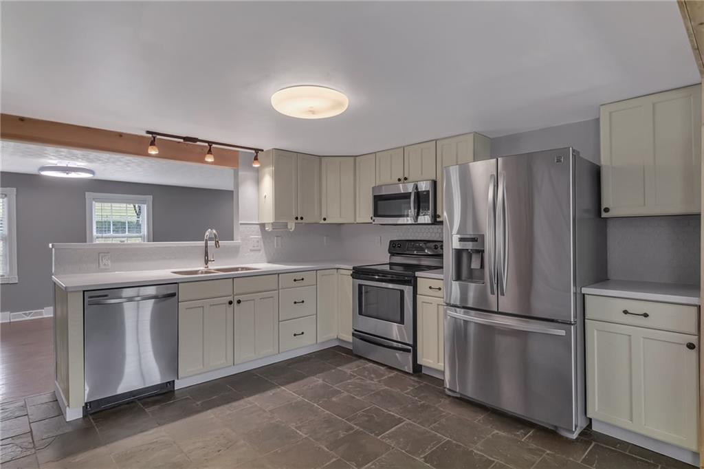 143 Inman Drive New Brighton, PA 15066 - Photo 7 of 29 a kitchen with cabinets stainless steel appliances and a counter space