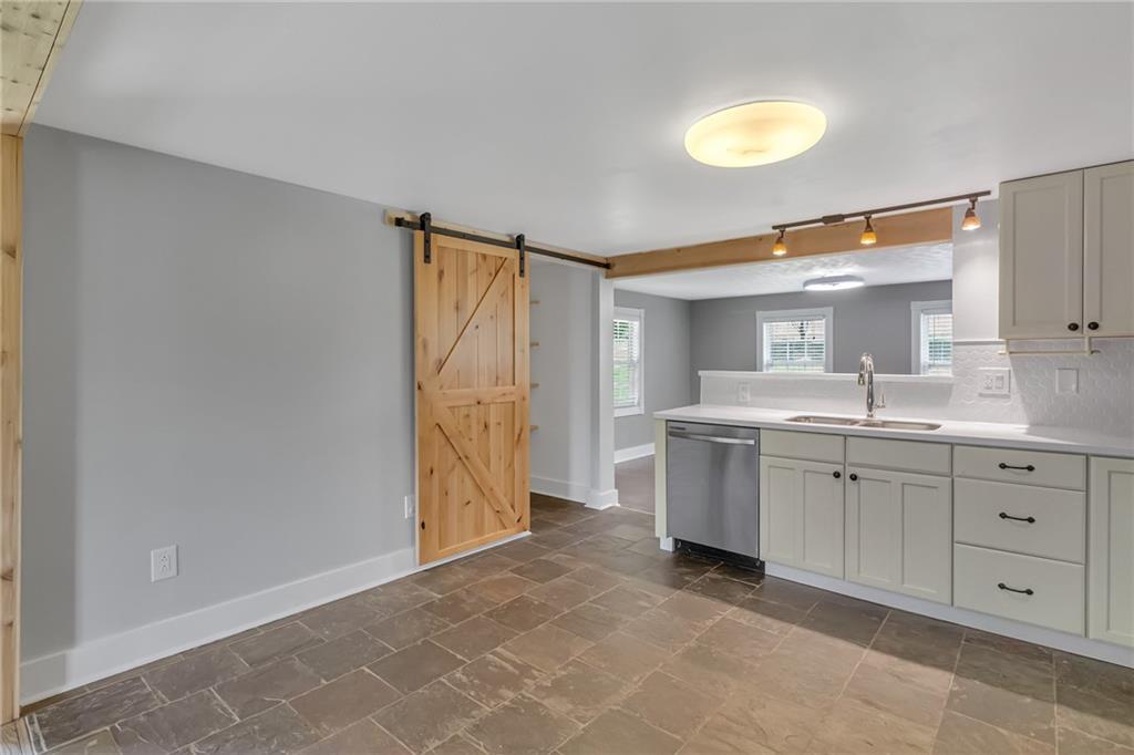 143 Inman Drive New Brighton, PA 15066 - Photo 8 of 29 a bathroom with a granite countertop sink mirror and vanity