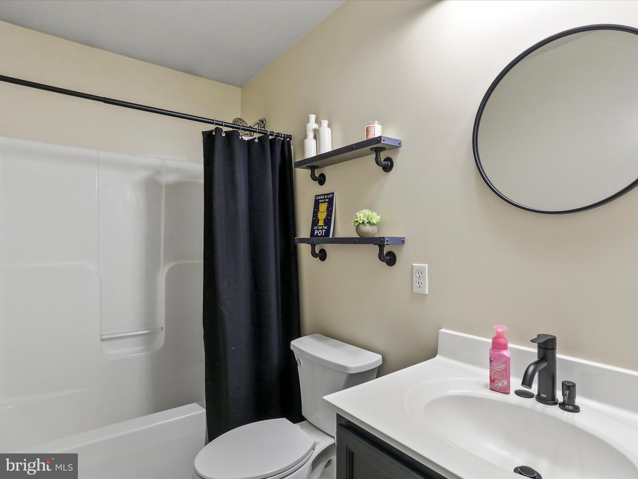 15 Snail Kite Road Martinsburg, WV 25405 - Photo 19 of 37 a bathroom with a sink toilet and a mirror