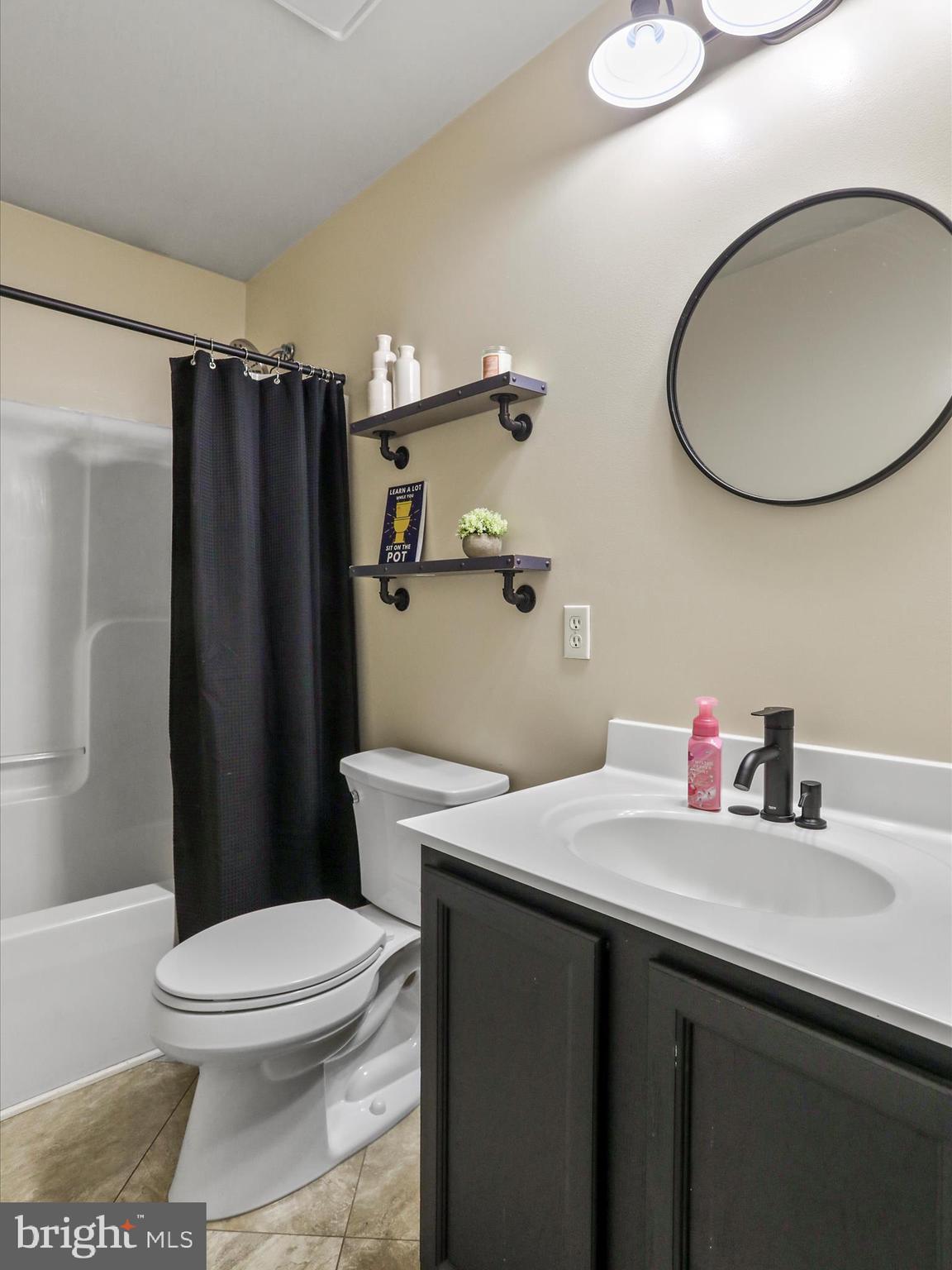 15 Snail Kite Road Martinsburg, WV 25405 - Photo 20 of 37 a bathroom with a sink a toilet and shower