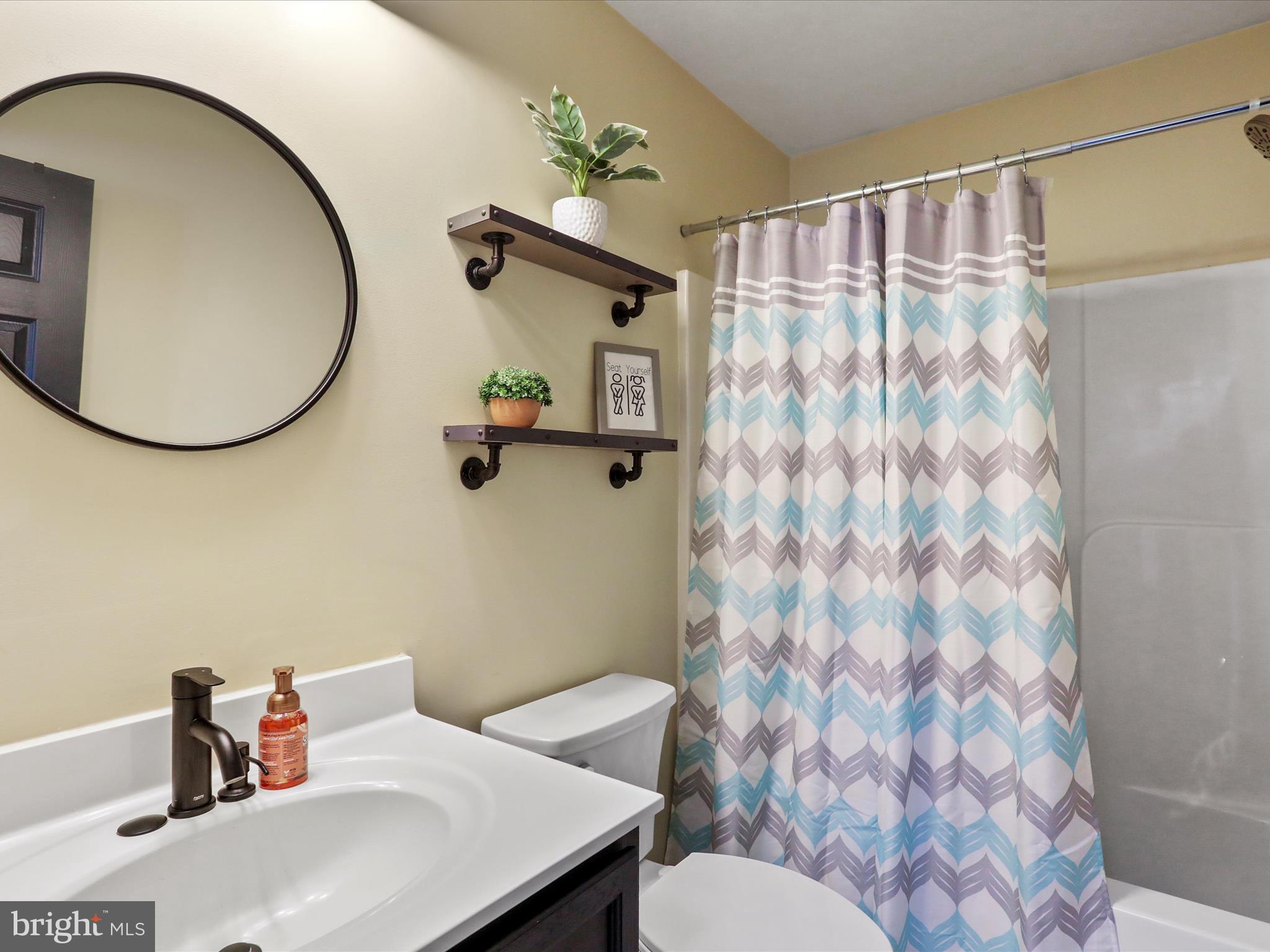 15 Snail Kite Road Martinsburg, WV 25405 - Photo 25 of 37 a bathroom with a sink and a mirror