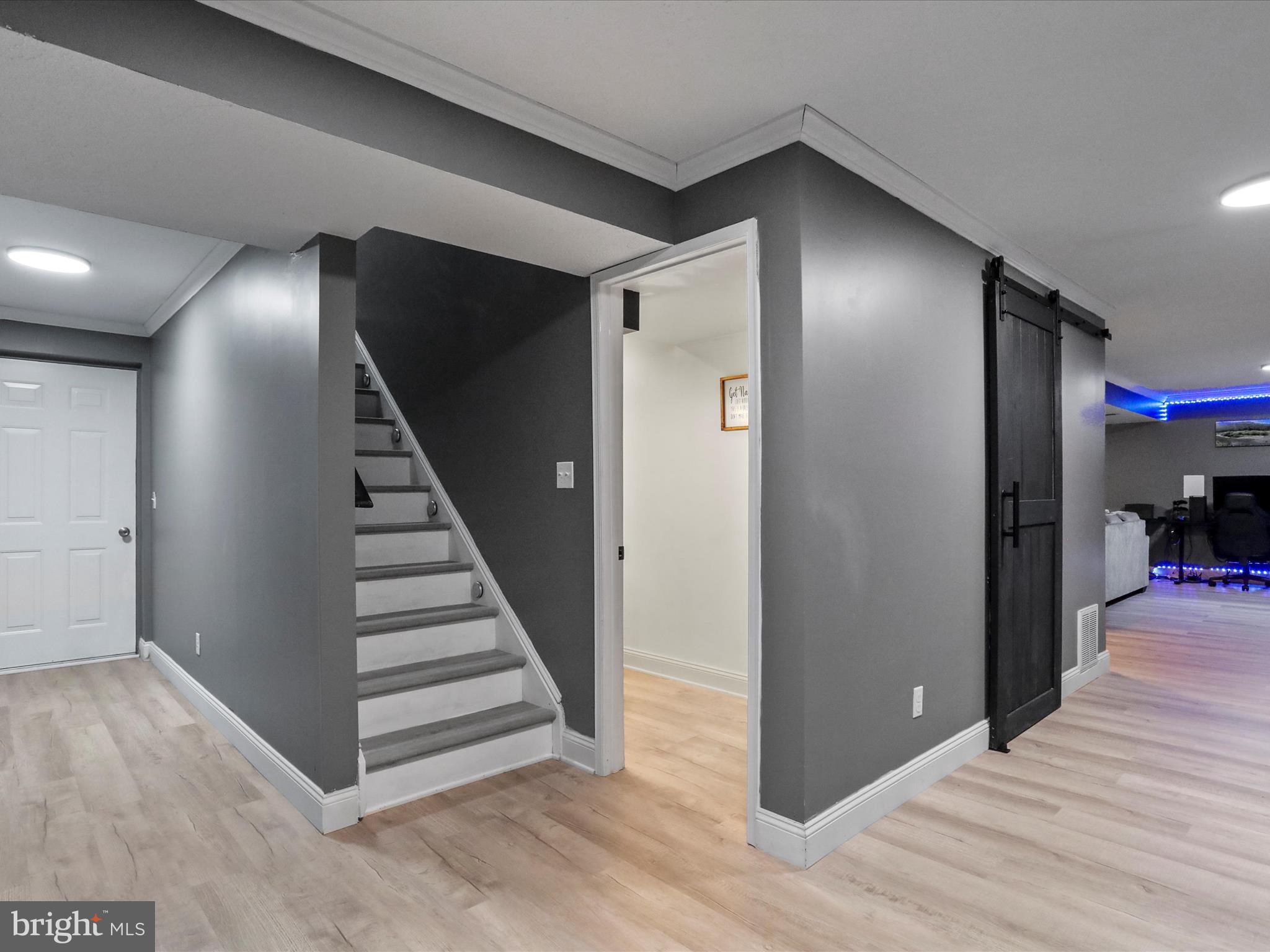 15 Snail Kite Road Martinsburg, WV 25405 - Photo 27 of 37 a view of a hallway with wooden floor and stairs