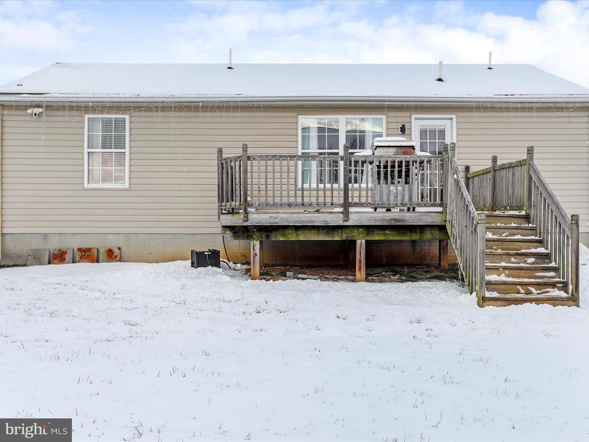 15 Snail Kite Road Martinsburg, WV 25405 - Photo 6 of 37 a view of house with wooden deck and a refrigerator