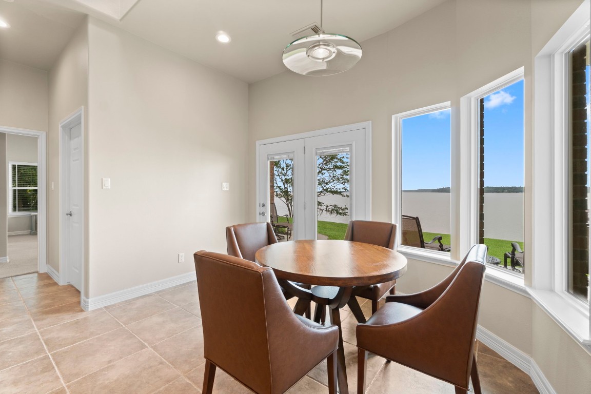 191 Beth Circle Huntsville, TX 77320 - Photo 12 of 50 a view of a dining room with furniture window and wooden floor
