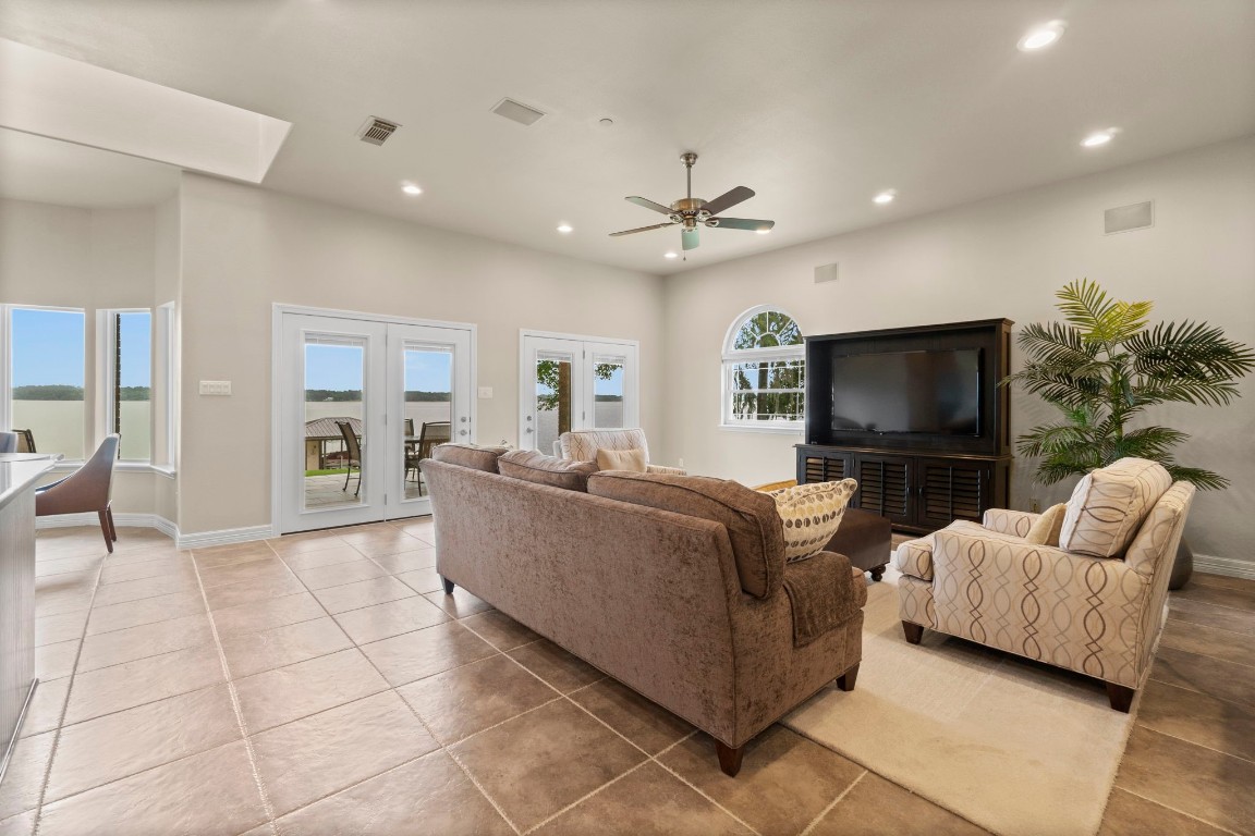 191 Beth Circle Huntsville, TX 77320 - Photo 16 of 50 a living room with furniture and a flat screen tv