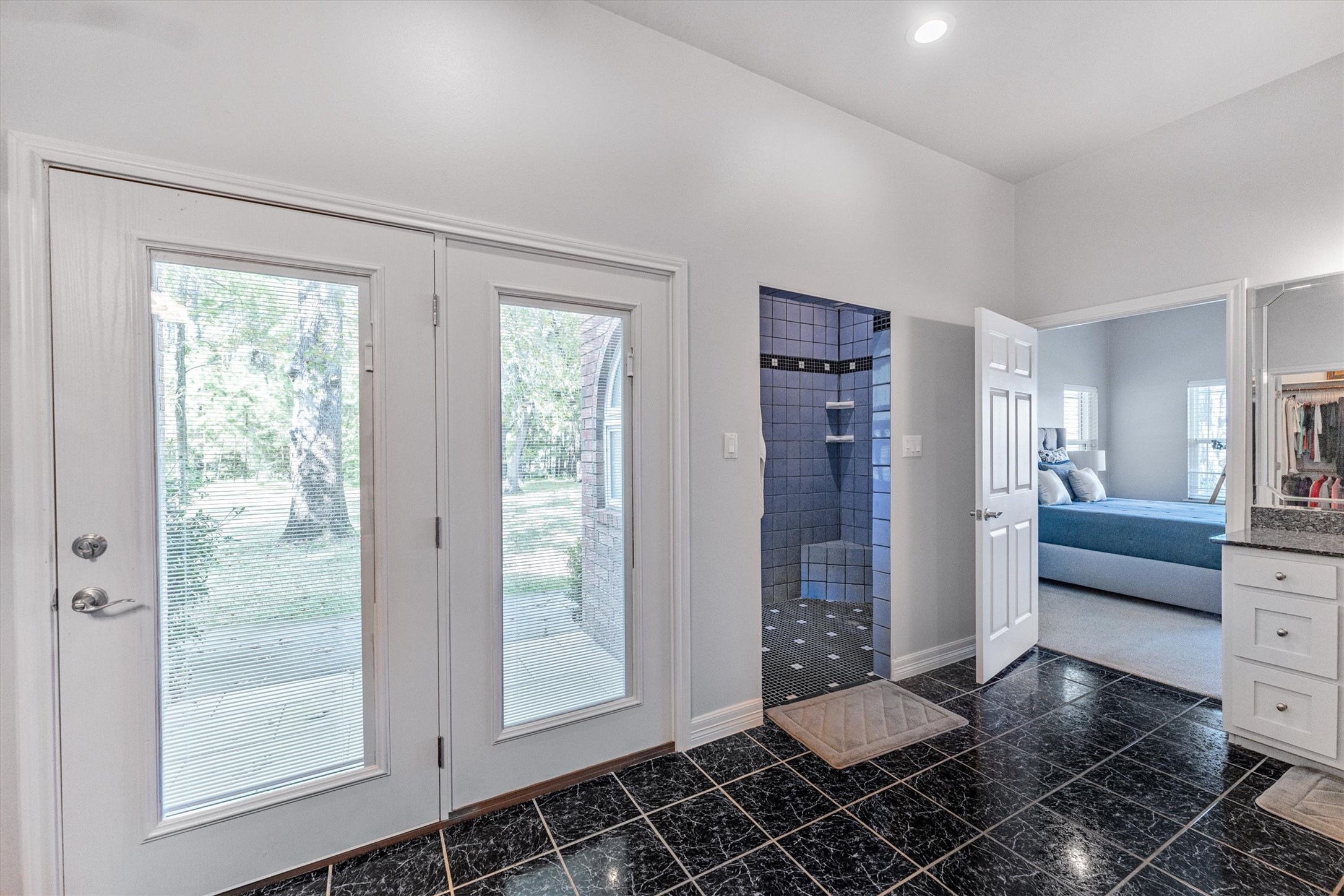 191 Beth Circle Huntsville, TX 77320 - Photo 23 of 50 a bathroom with a glass door shower and a sink