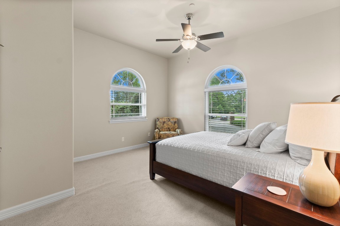 191 Beth Circle Huntsville, TX 77320 - Photo 25 of 50 a bedroom with a bed and window
