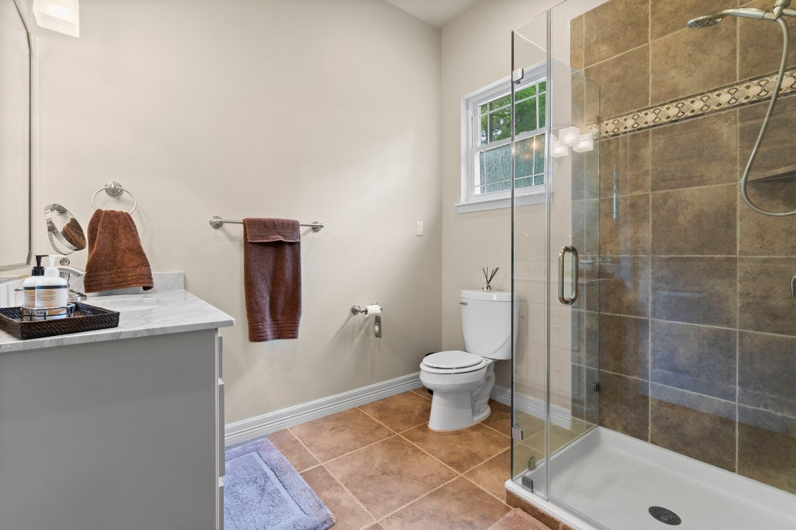 191 Beth Circle Huntsville, TX 77320 - Photo 27 of 50 a bathroom with a sink a toilet and shower