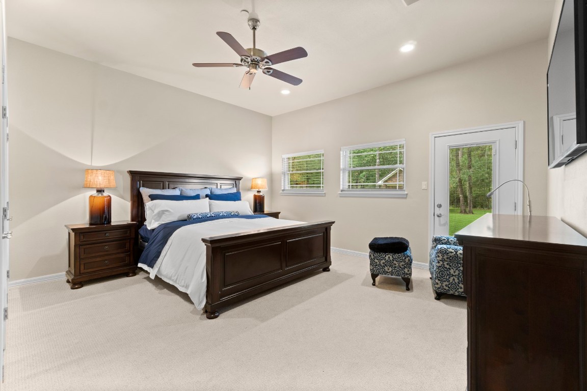 191 Beth Circle Huntsville, TX 77320 - Photo 28 of 50 With three spacious bedrooms, you'll always have room for company. This inviting guest room offers plush carpet, neutral paint, ample closet space, easy access to a full bathroom, and ensuite access to the outdoors.