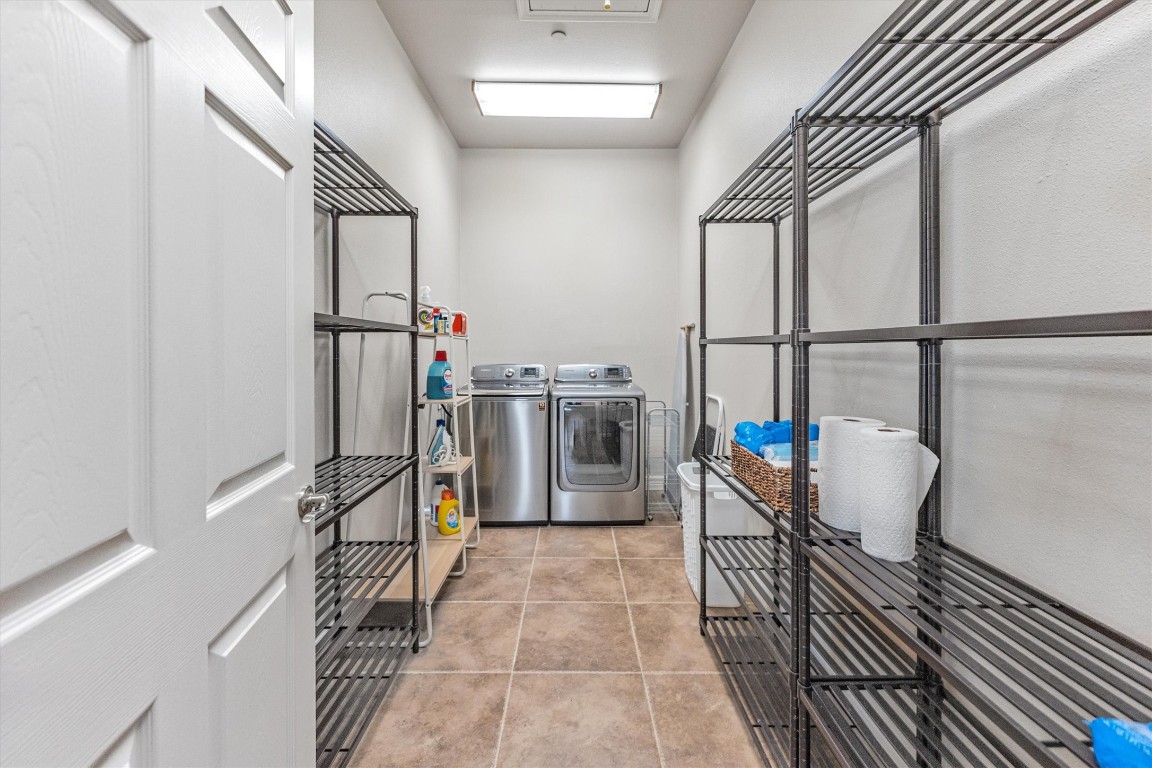 191 Beth Circle Huntsville, TX 77320 - Photo 31 of 50 An oversized utility room offers tile flooring, neutral paint, and plenty of space for household storage.