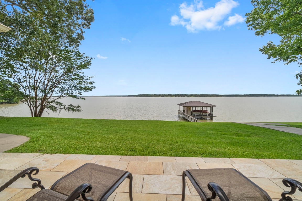 191 Beth Circle Huntsville, TX 77320 - Photo 35 of 50 a view of a backyard with a garden and entertaining space