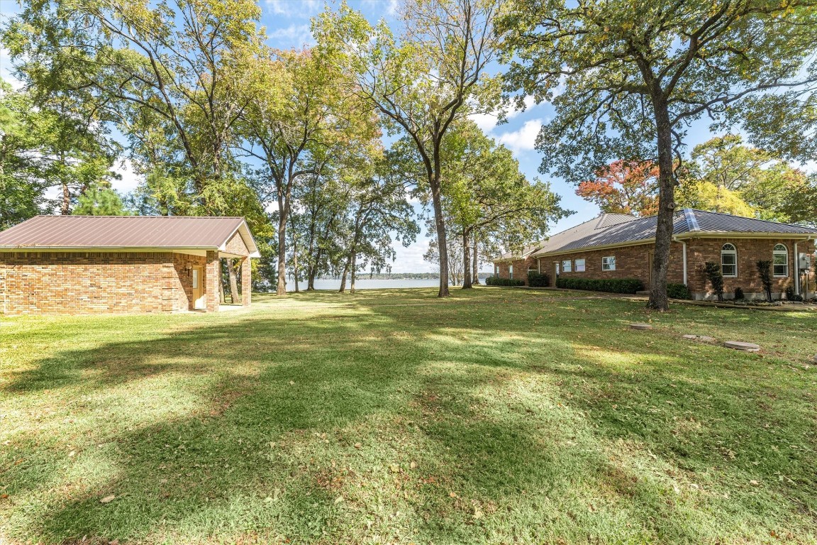 191 Beth Circle Huntsville, TX 77320 - Photo 36 of 50 a front view of a house with a big yard
