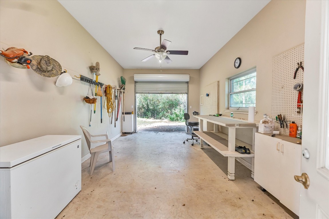 191 Beth Circle Huntsville, TX 77320 - Photo 39 of 50 The rolling bay door and rear access make this space ideal for golf carts, lawn equipment, or larger projects. With ample workspace and great natural light, it’s the ultimate combination of utility and inspiration.