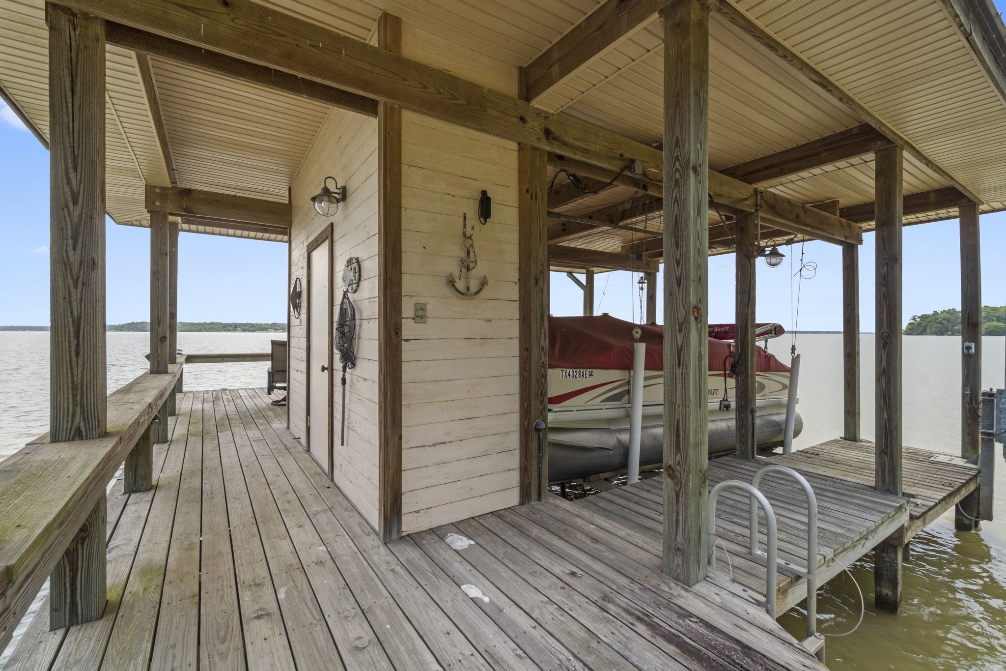 191 Beth Circle Huntsville, TX 77320 - Photo 44 of 50 a view of balcony and deck with wooden floor