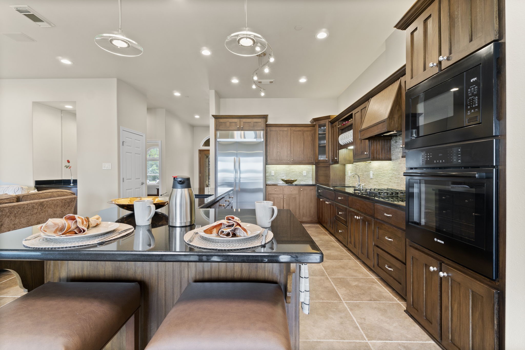 191 Beth Circle Huntsville, TX 77320 - Photo 9 of 50 a open kitchen with stainless steel appliances kitchen island granite countertop a sink and cabinets