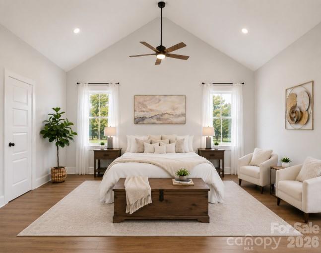 9745 Flowes Store Road Midland, NC 28107 - Photo 13 of 20 a bedroom with a bed couches and potted plant