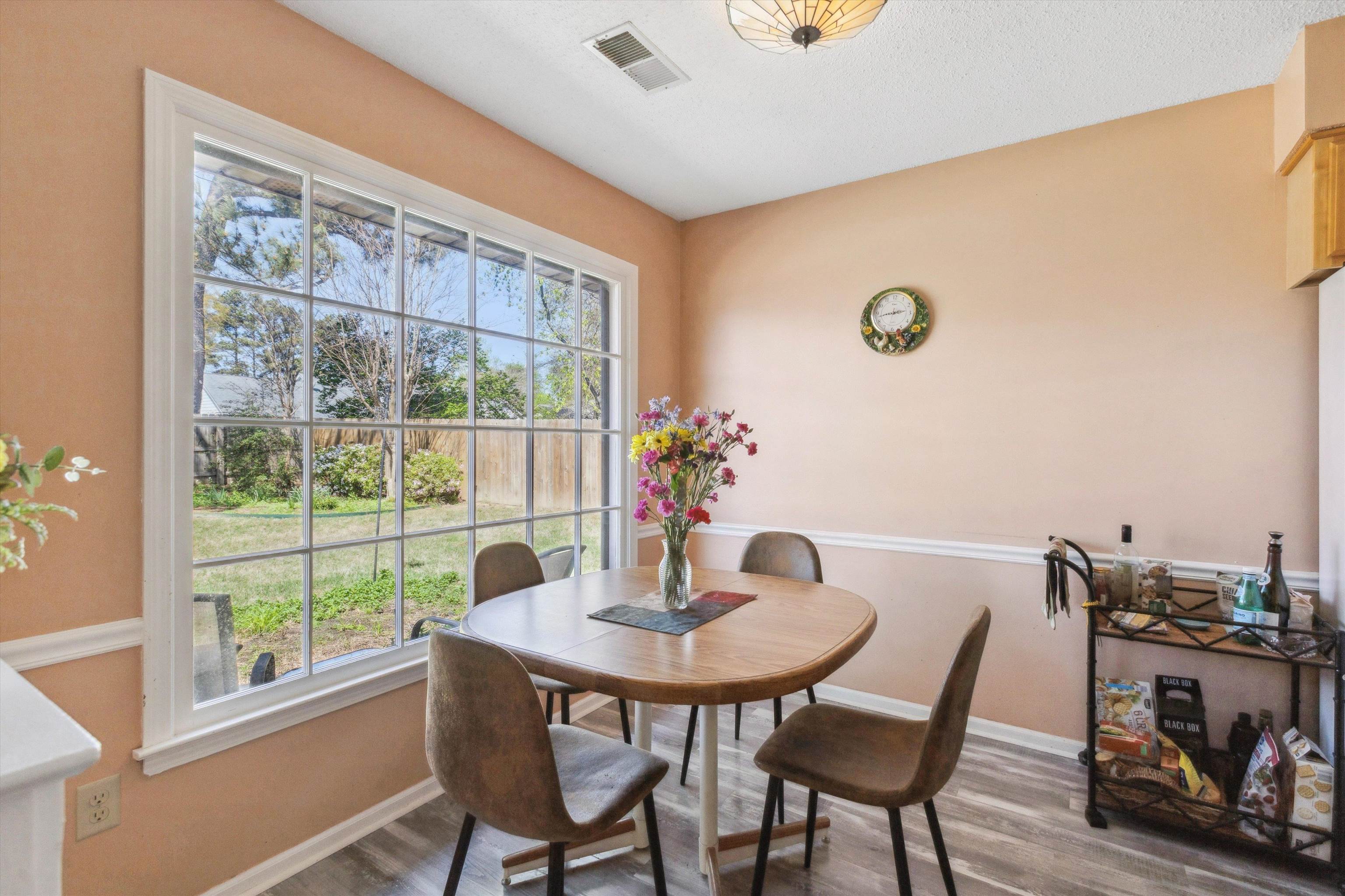 6972 Crestridge Road Memphis, TN 38119 - Photo 14 of 26 Dining area featuring wood finished floors, baseboards, and visible vents