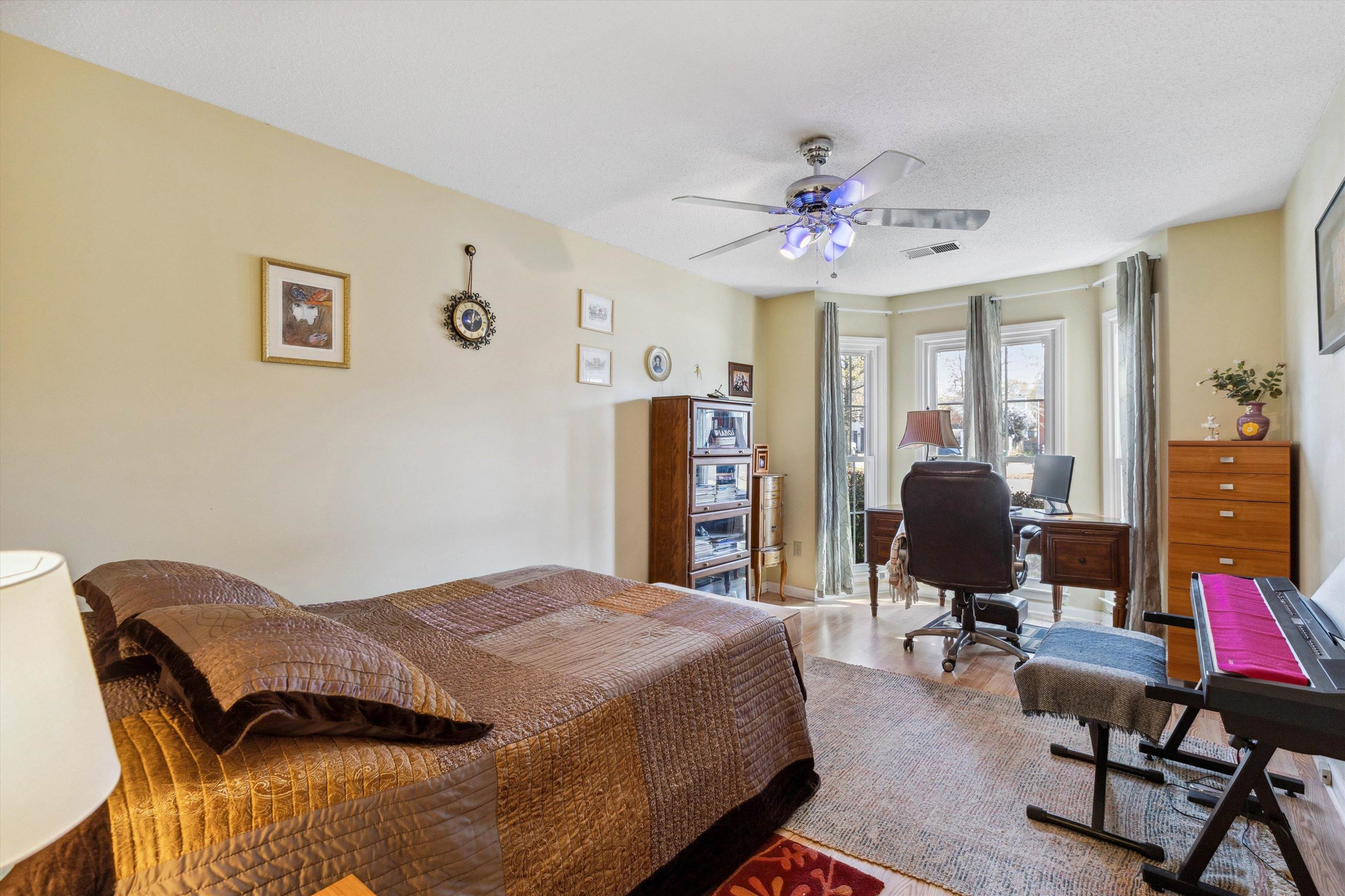 6972 Crestridge Road Memphis, TN 38119 - Photo 18 of 26 Bedroom with visible vents, a ceiling fan, and wood finished floors