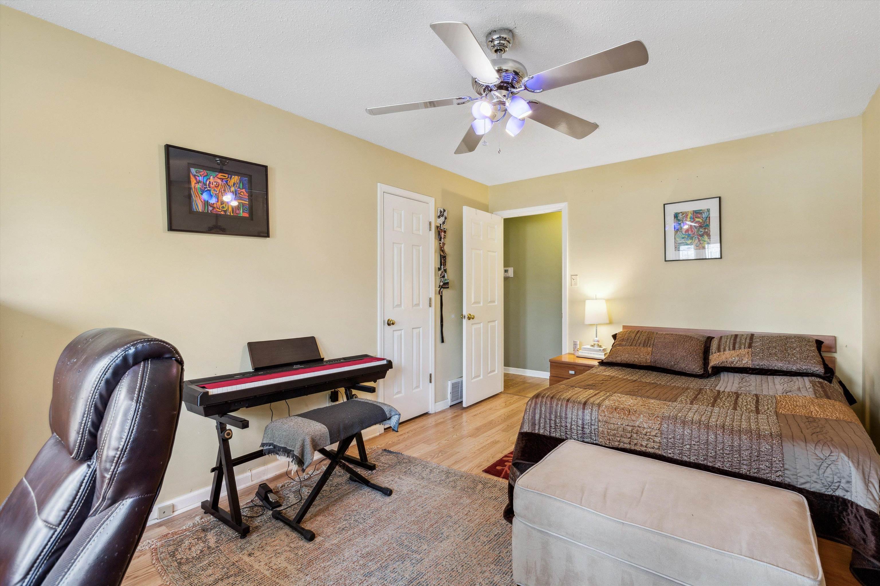 6972 Crestridge Road Memphis, TN 38119 - Photo 19 of 26 Bedroom featuring baseboards, ceiling fan, and wood finished floors