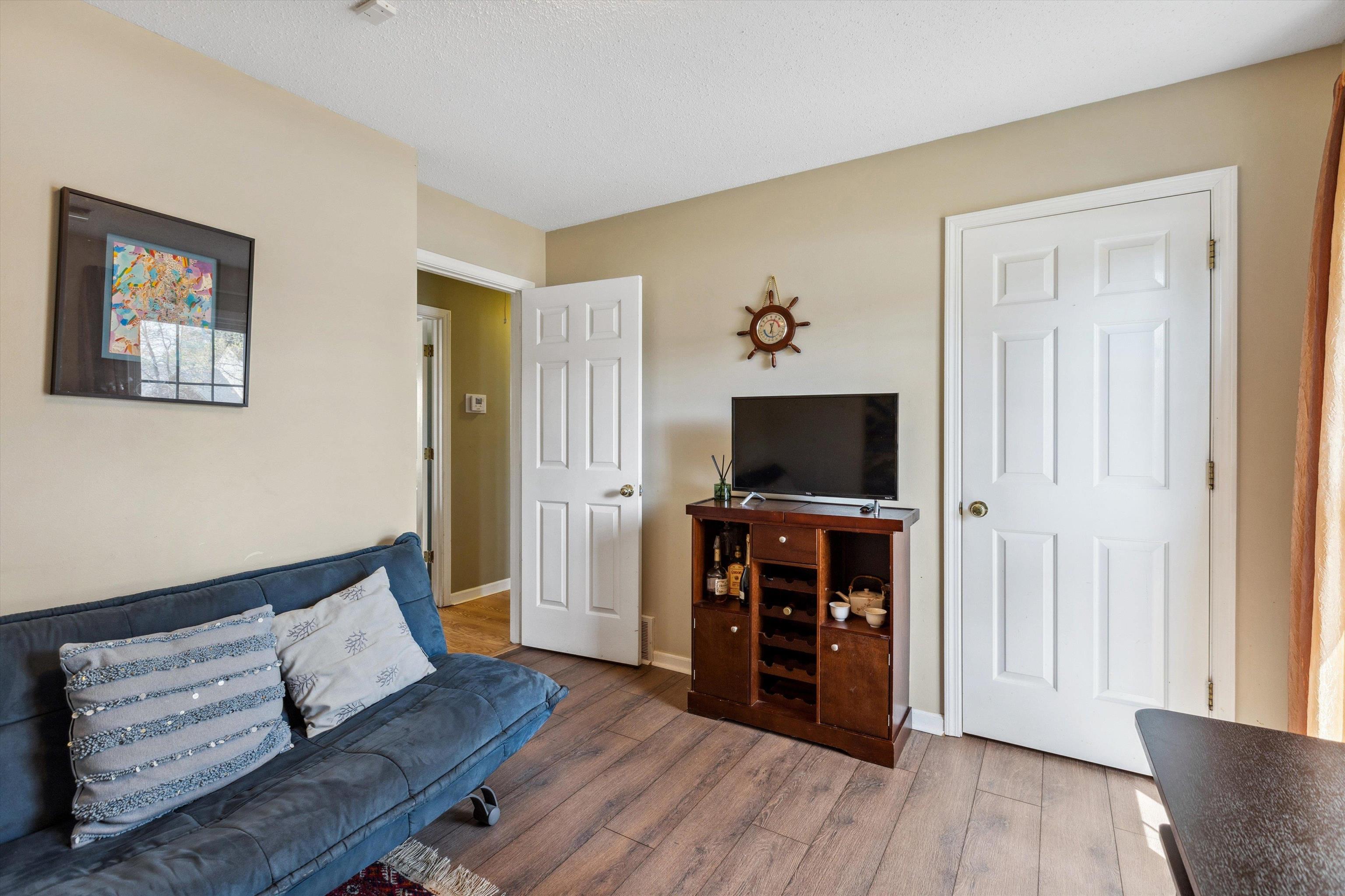 6972 Crestridge Road Memphis, TN 38119 - Photo 21 of 26 Living room with baseboards and wood finished floors
