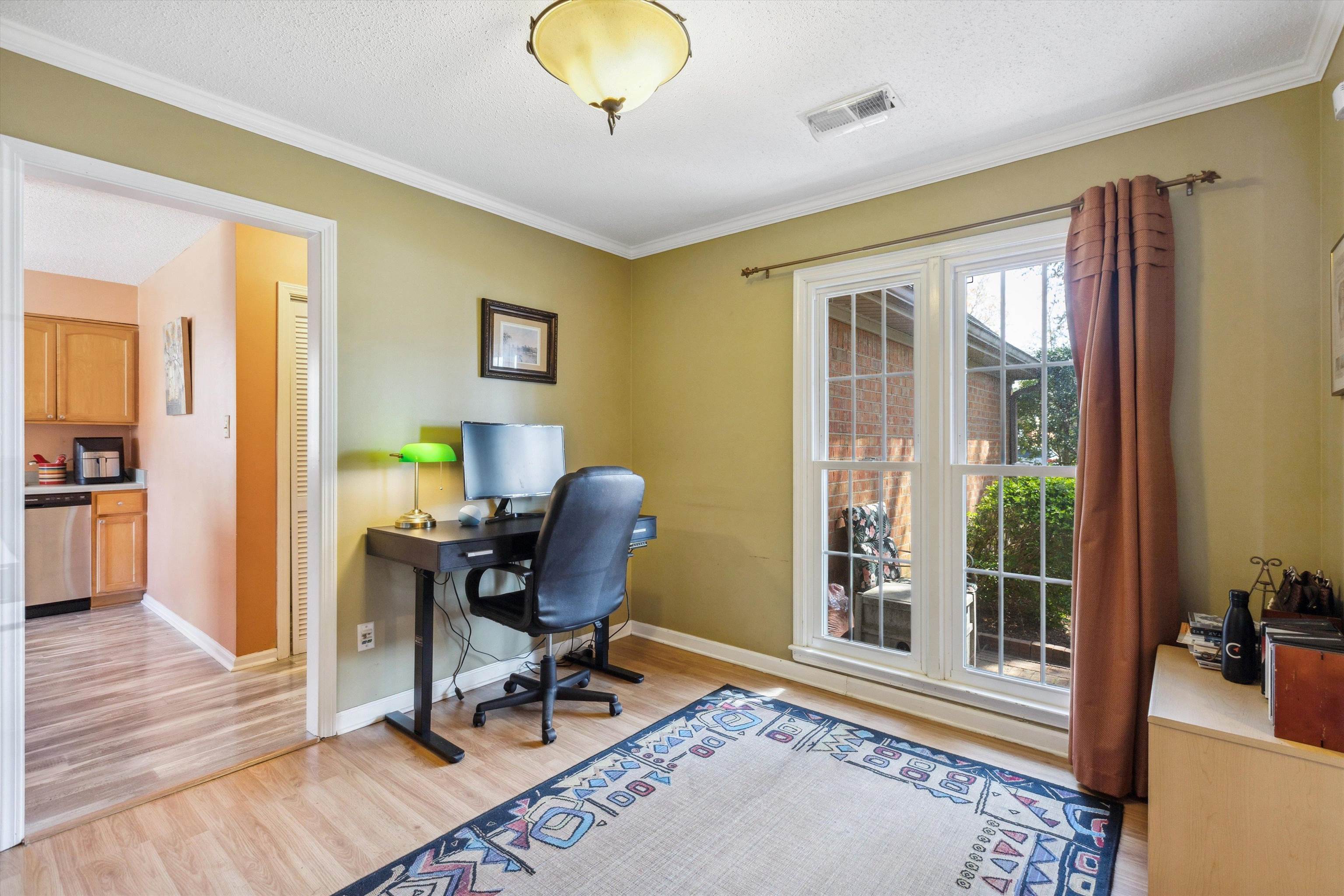 6972 Crestridge Road Memphis, TN 38119 - Photo 6 of 26 Home office featuring a textured ceiling, visible vents, light wood finished floors, baseboards, and ornamental molding