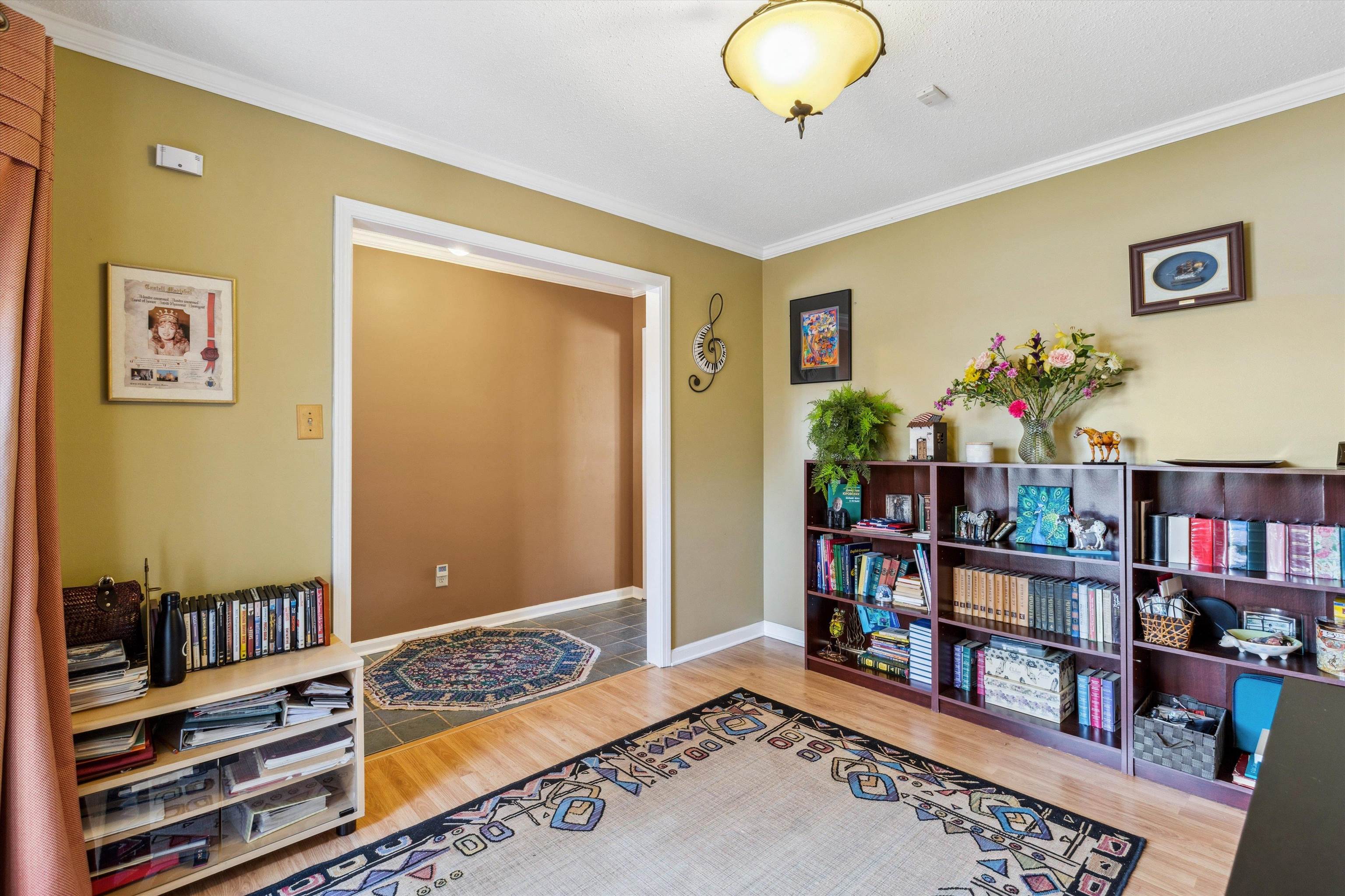 6972 Crestridge Road Memphis, TN 38119 - Photo 7 of 26 Living area featuring baseboards, ornamental molding, and wood finished floors