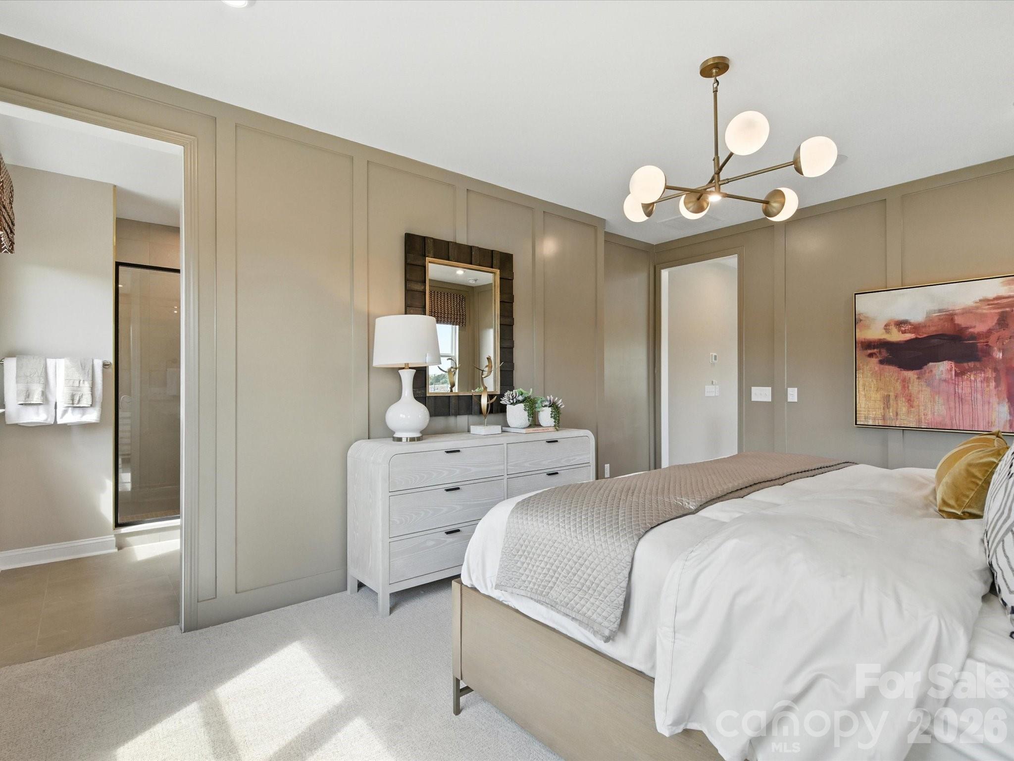 412 Nash Street Fort Mill, SC 29715 - Photo 17 of 21 a bedroom with a bed chandelier and a window
