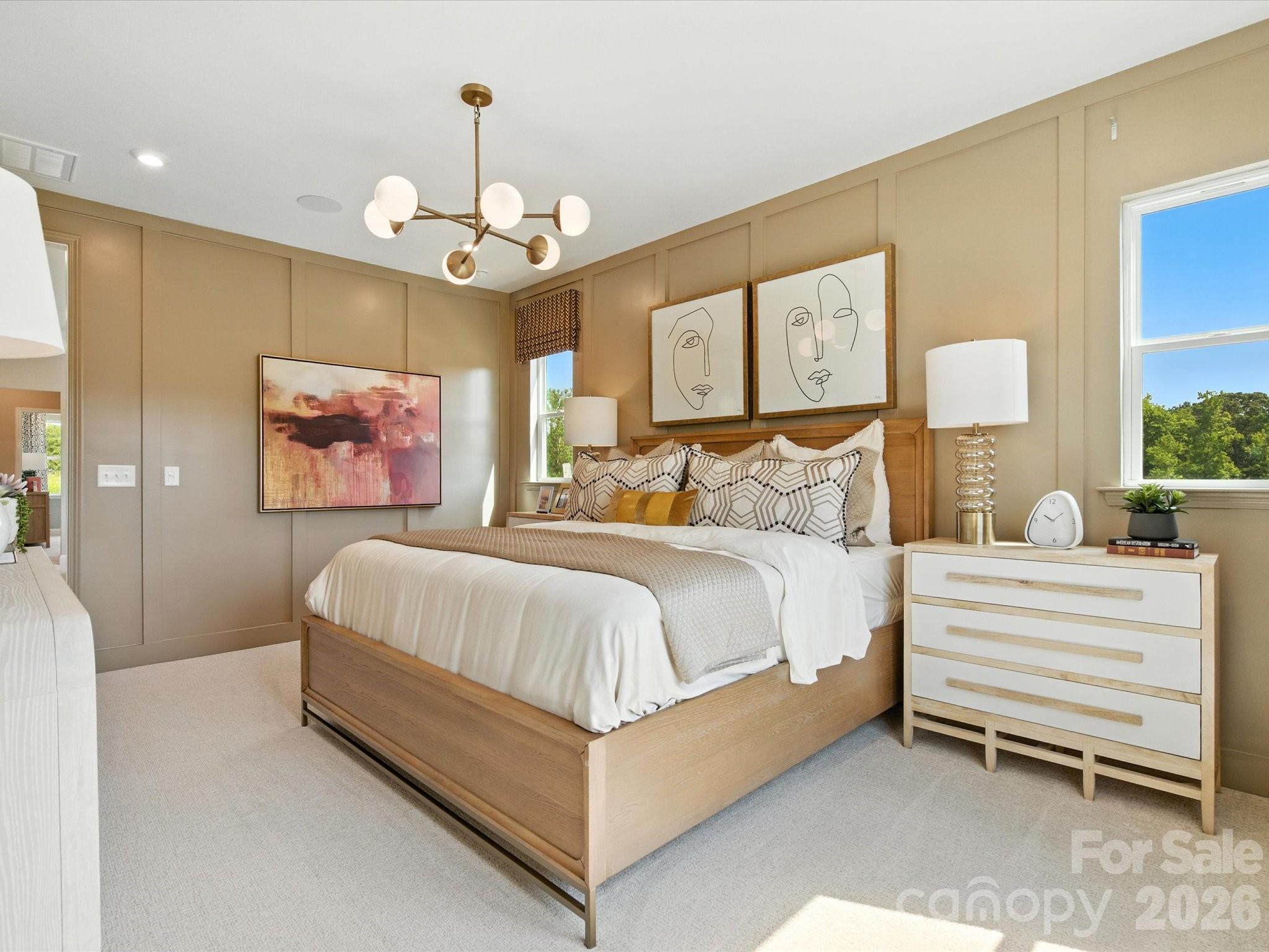 412 Nash Street Fort Mill, SC 29715 - Photo 18 of 21 a spacious bedroom with a bed and a chandelier