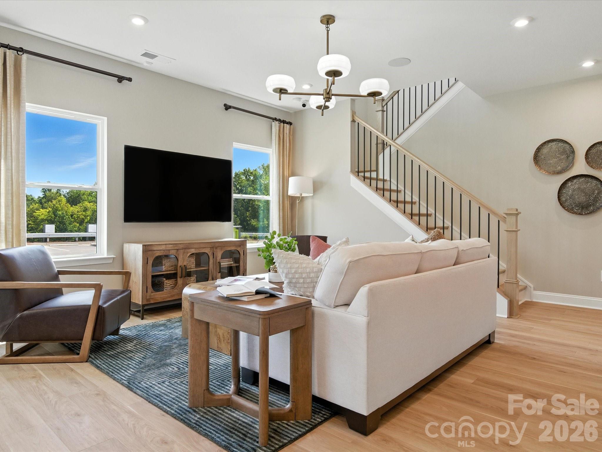 412 Nash Street Fort Mill, SC 29715 - Photo 3 of 21 a living room with furniture and a flat screen tv