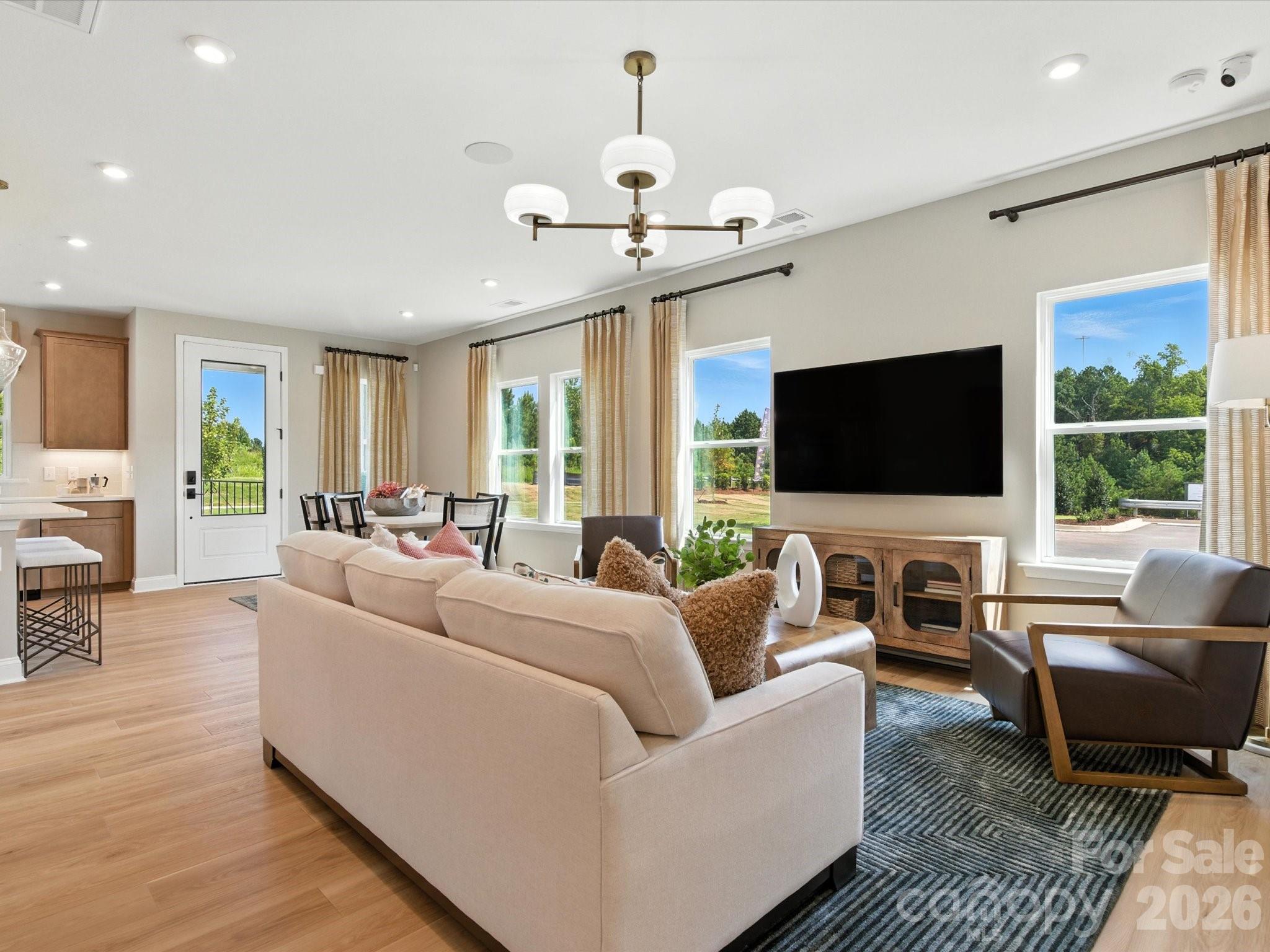 412 Nash Street Fort Mill, SC 29715 - Photo 4 of 21 a living room with furniture and a flat screen tv