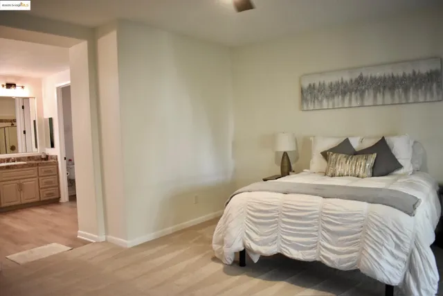 a bedroom with a bed and a view of bedroom