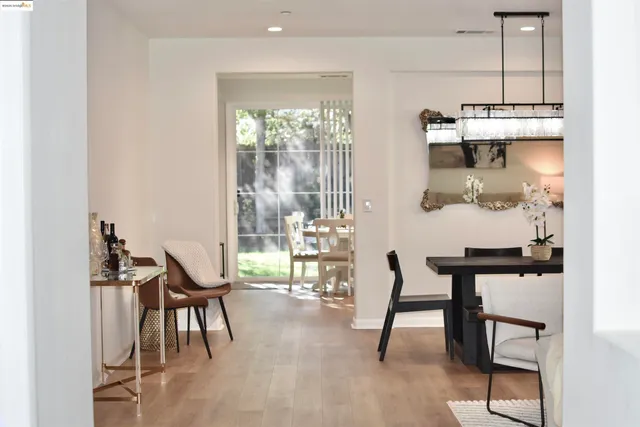 a view of a dining room with furniture and a window