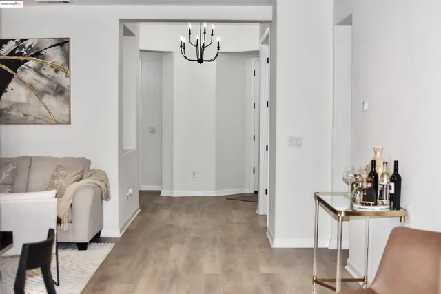 a view of room with furniture and wooden floor