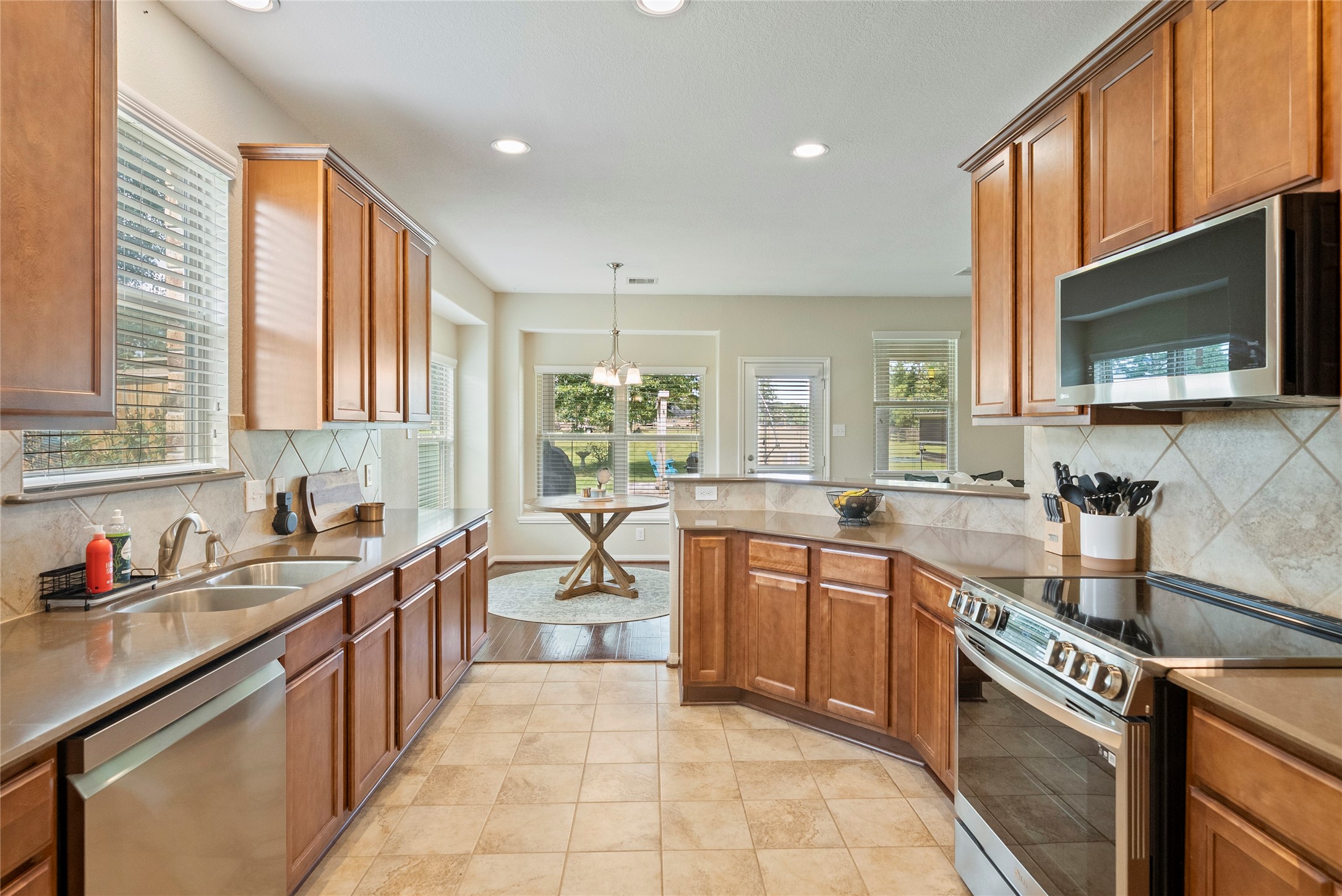 9160 Wapiti Trail Conroe, TX 77303 - Photo 12 of 48 Spacious kitchen featuring modern stainless steel appliances.