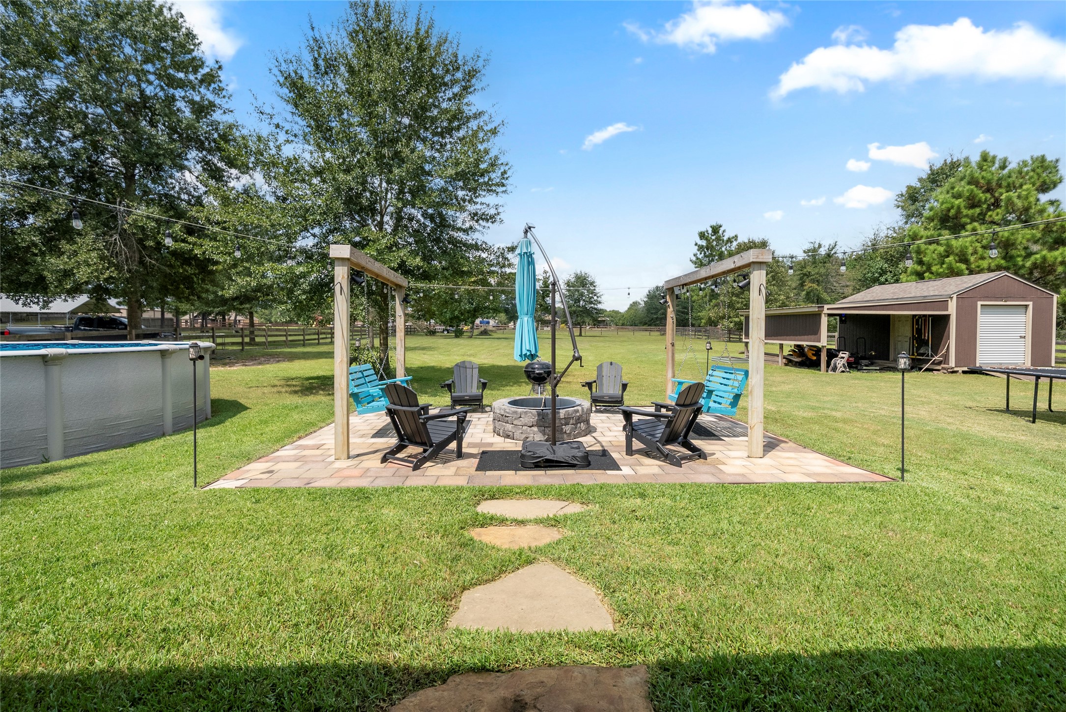 9160 Wapiti Trail Conroe, TX 77303 - Photo 26 of 48 Right off the patio follow the stepping stone path to your own cozy firepit.