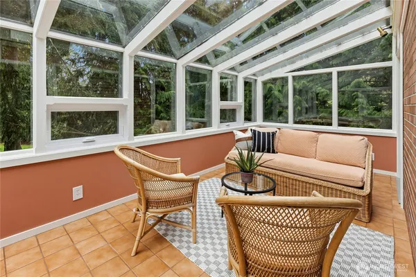 a view of a patio with couches chairs and potted plants