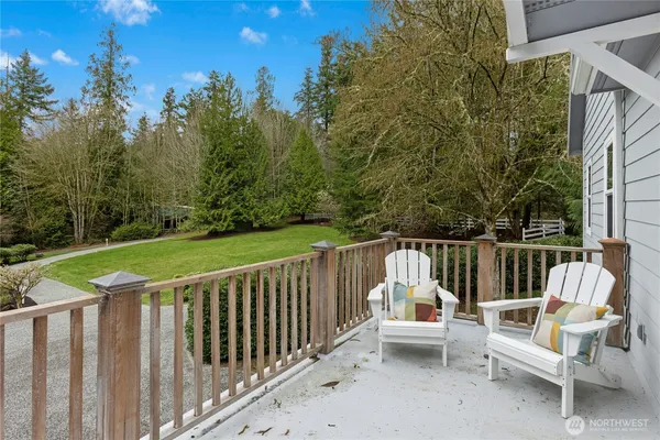 a view of deck with two chairs and a table