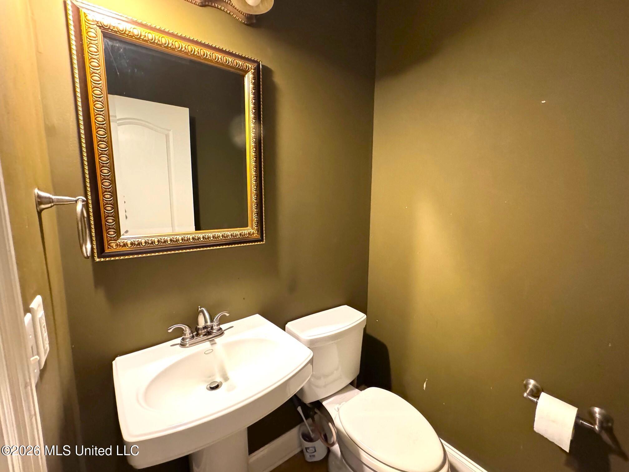 1038 Deerfield Road Summit, MS 39666 - Photo 29 of 32 Half bath off kitchen