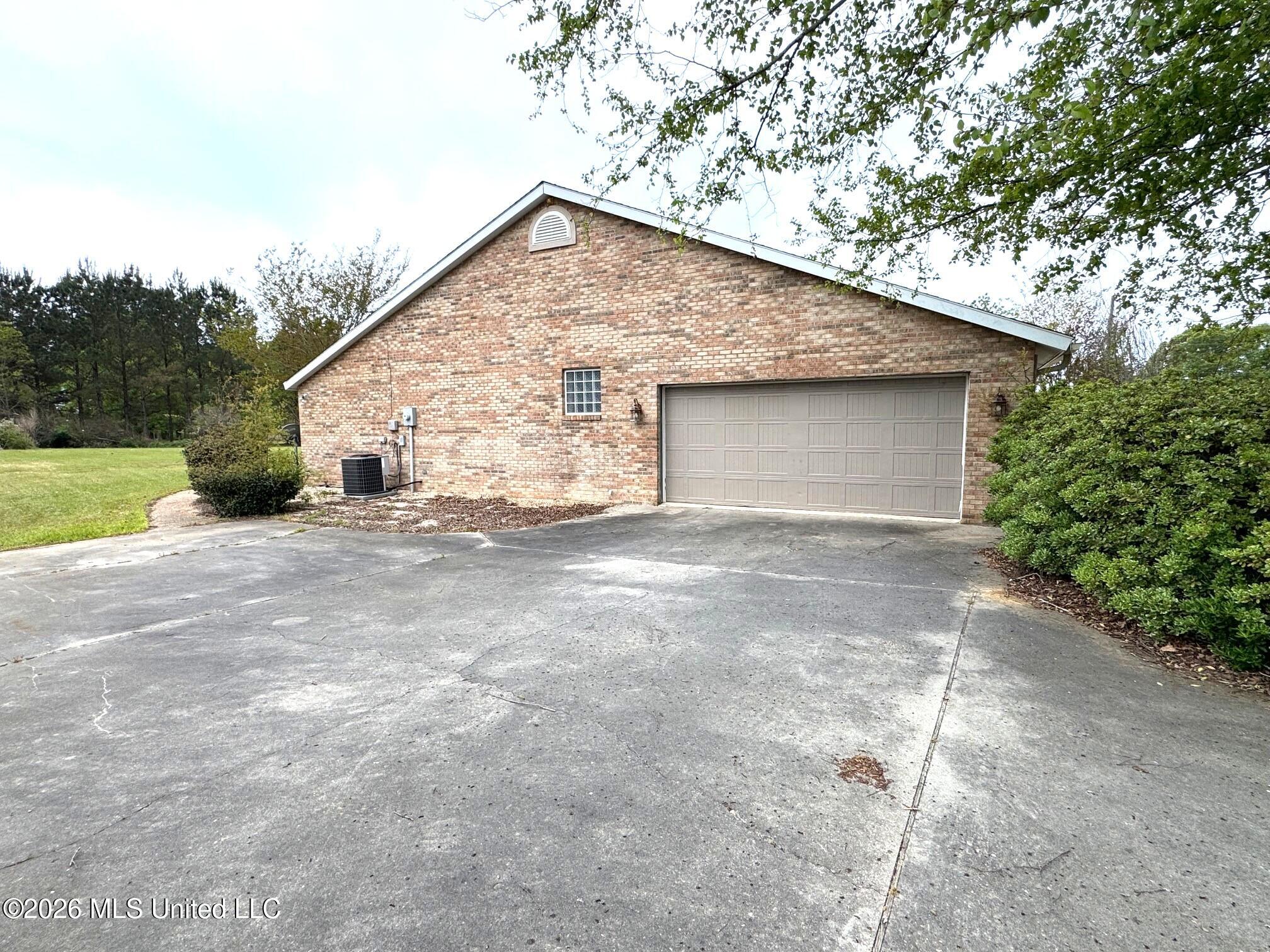 1038 Deerfield Road Summit, MS 39666 - Photo 31 of 32 East side/garage door