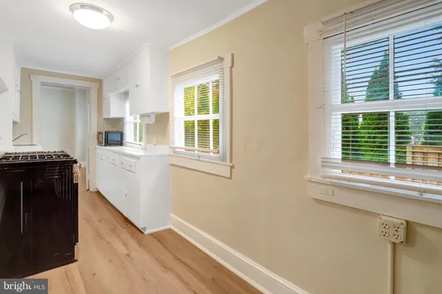 a view of a kitchen cabinets and a window