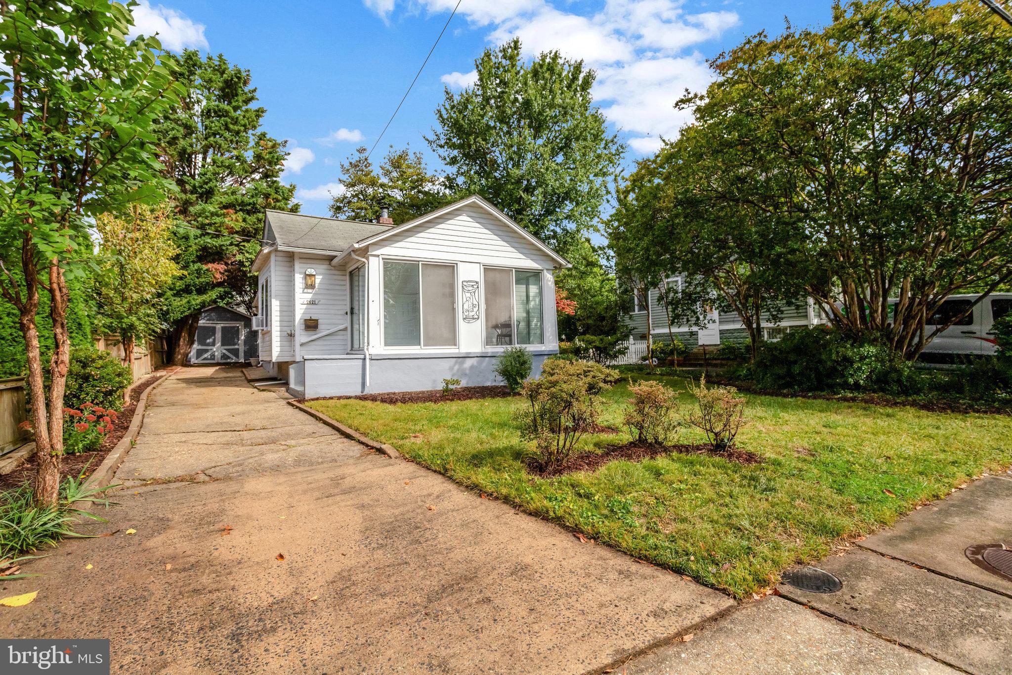 2621 2nd Road North Arlington, VA 22201 - Photo 2 of 44 a view of a house with a small yard plants and large tree