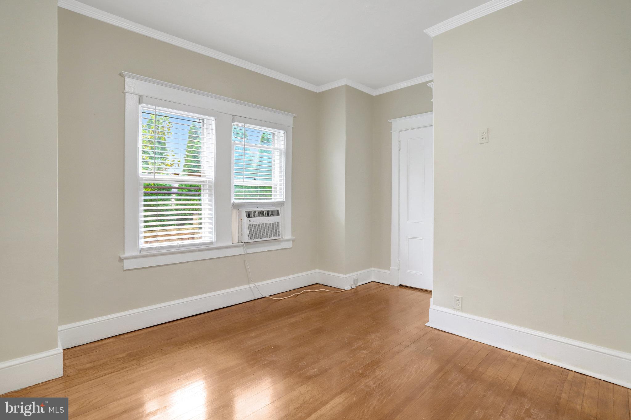 2621 2nd Road North Arlington, VA 22201 - Photo 22 of 44 a view of an empty room with wooden floor and a window