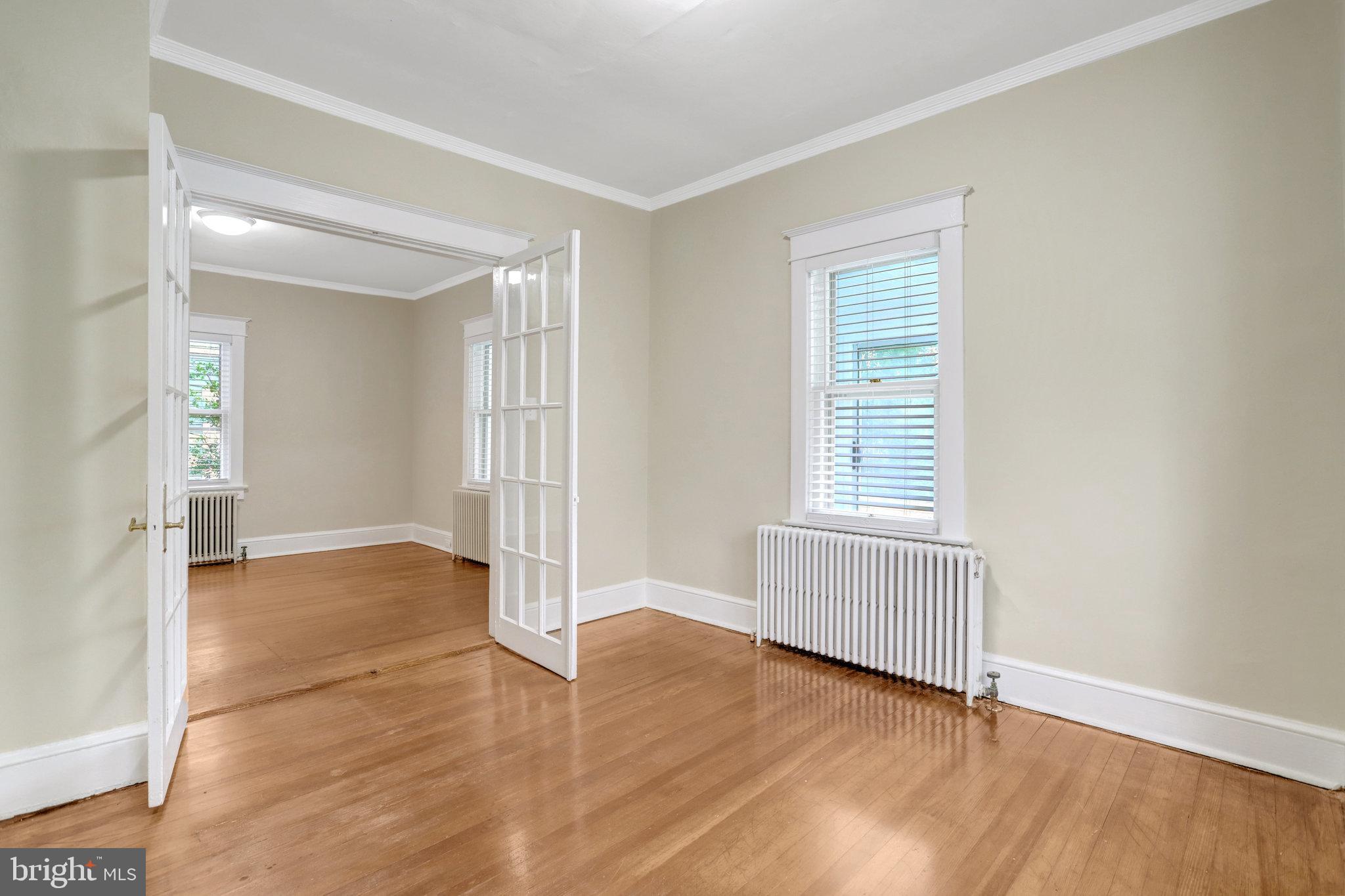 2621 2nd Road North Arlington, VA 22201 - Photo 23 of 44 an empty room with wooden floor and windows
